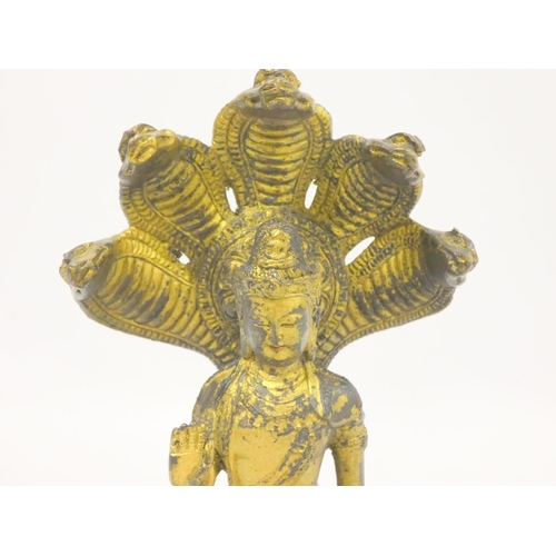 233 - Tibetan gilt bronze Guanyin Naga figure with five cobra aureole, bearing six character inscription m... 