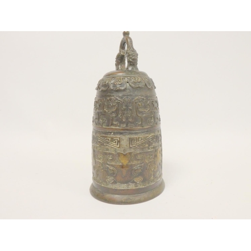 237 - Chinese cast bronze Qing dynasty temple bell with archaic motifs and dragon loupe handle. Height 29c... 