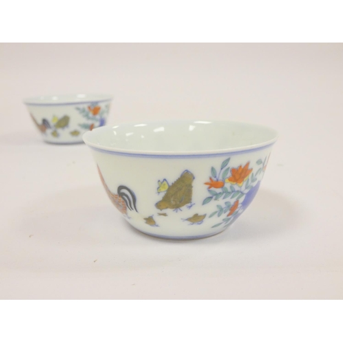 240 - Pair of Chinese porcelain chicken cups in the Ming style with character marks to base. (2)