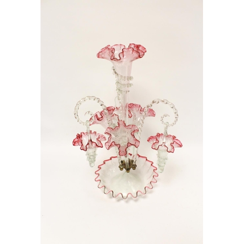 297 - Edwardian cranberry and clear glass table epergne with four trumpets and three hanging baskets. Heig... 