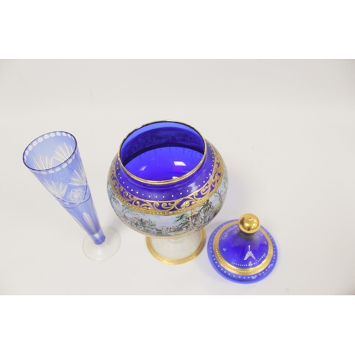 298 - Continental blue and gilt Bohemian style glass cup and cover and a blue flash trumpet vase. (2)