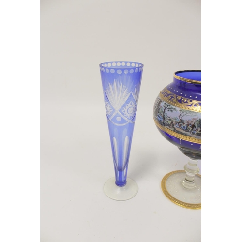 298 - Continental blue and gilt Bohemian style glass cup and cover and a blue flash trumpet vase. (2)