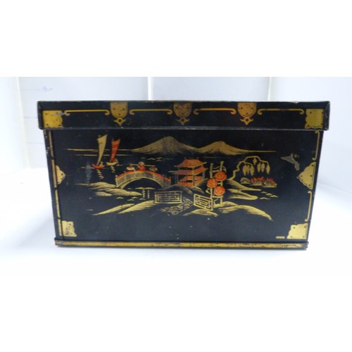 409A - Two Japanese tin boxes containing two Chinese patch boxes, bugle and miscellaneous coinage.