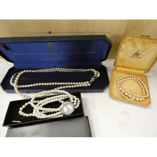 401 - Three vintage faux pearl necklaces and bracelets.