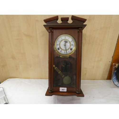 407 - Modern mahogany wall clock.