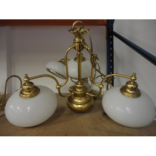 579 - Two three-branch brass ceiling lights and shades.