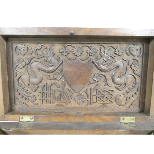 257 - 19th century Chinese camphor wood box the lid bearing a family crest flanked by two five clawed drag... 