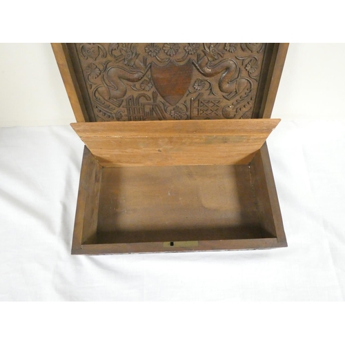 257 - 19th century Chinese camphor wood box the lid bearing a family crest flanked by two five clawed drag... 