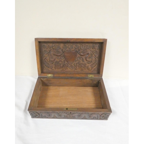 257 - 19th century Chinese camphor wood box the lid bearing a family crest flanked by two five clawed drag... 