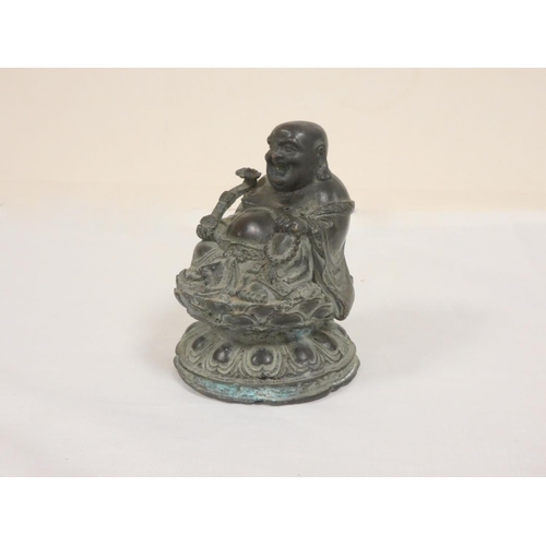 259 - 19th century Chinese Budai, or laughing Buddha, bronze figure seated upon a lotus flower grasping a ... 