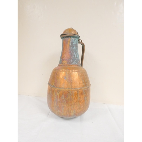 281 - 19th century Middle Eastern large lidded copper water jug. Height 45cm.