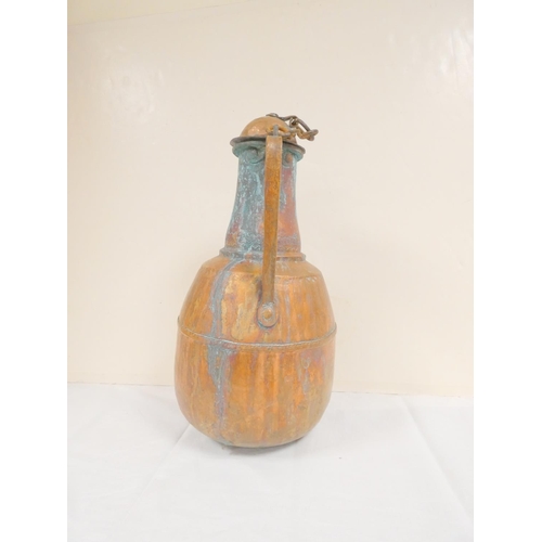 281 - 19th century Middle Eastern large lidded copper water jug. Height 45cm.