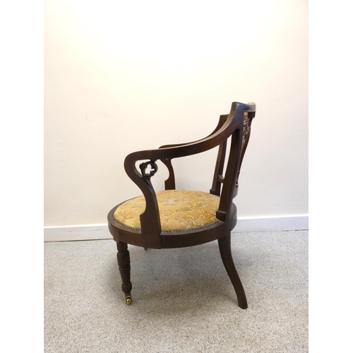 441 - Edwardian upholstered mahogany tub chair with scrolled floral backrest decorated with lion masks and... 