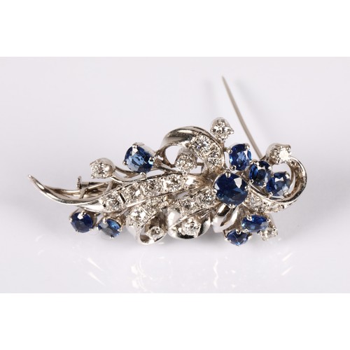 52A - Ladies 14ct whit gold Diamond & Sapphire cluster brooch, set with nine oval cut Sapphires and tw... 