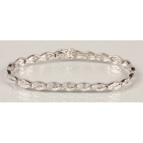 53A - Ladies 18ct white gold Diamond bracelet, consisting of twenty two links set with baguette cut diamon... 