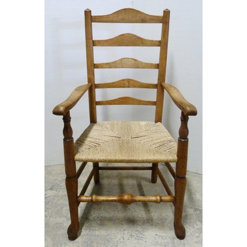 549 - Ash and elm ladder-back carver chair, c. early 20th century, with woven seat, on turned supports and... 