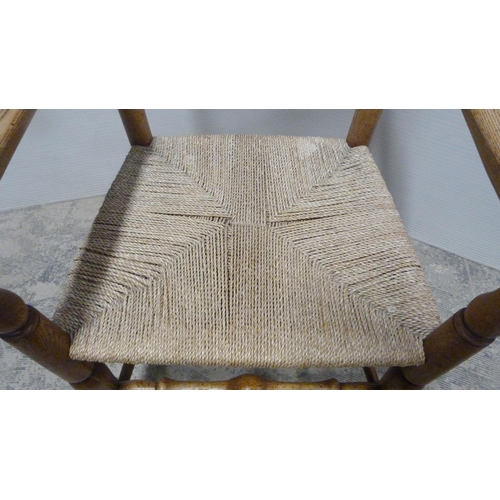 549 - Ash and elm ladder-back carver chair, c. early 20th century, with woven seat, on turned supports and... 