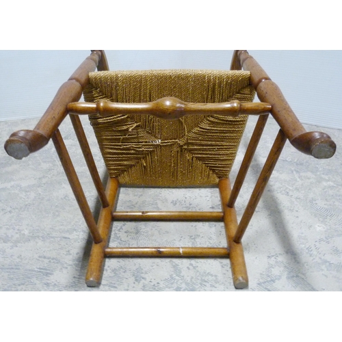 549 - Ash and elm ladder-back carver chair, c. early 20th century, with woven seat, on turned supports and... 