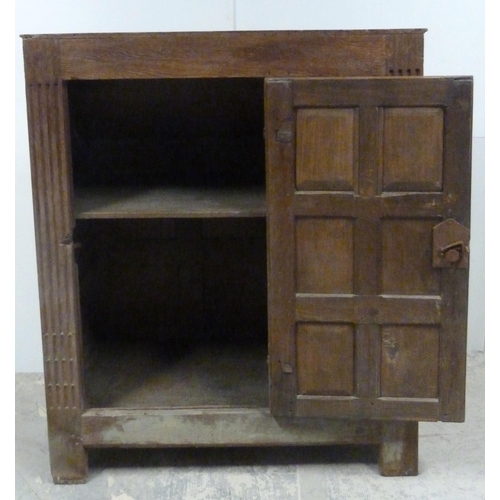 551 - Antique oak lectern with sloped ledge to the front above six panels, flanked by reeded columns, with... 