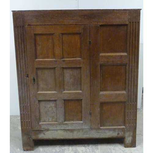 551 - Antique oak lectern with sloped ledge to the front above six panels, flanked by reeded columns, with... 