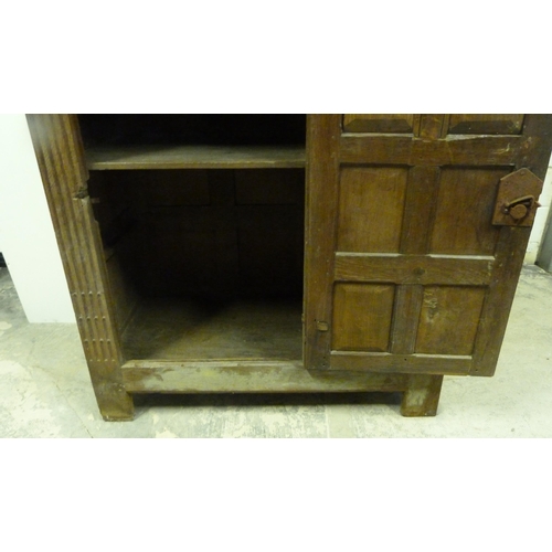 551 - Antique oak lectern with sloped ledge to the front above six panels, flanked by reeded columns, with... 