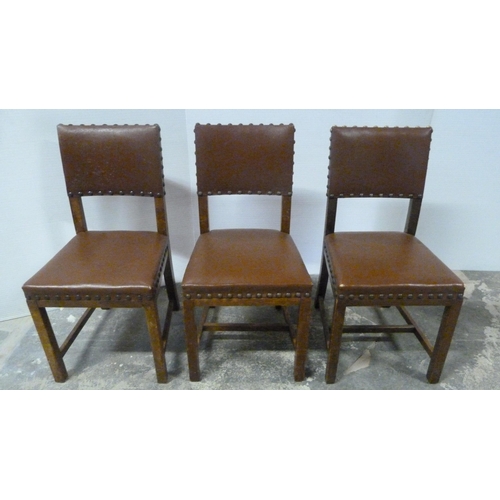 552 - Near-set of thirty oak English dining chairs, c. 1950s, with studded upholstery, stamped to the unde... 