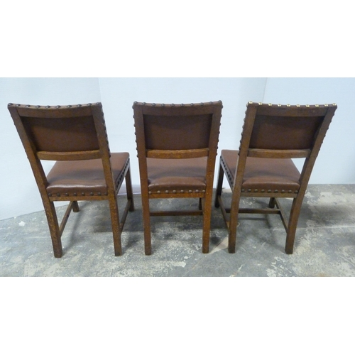 552 - Near-set of thirty oak English dining chairs, c. 1950s, with studded upholstery, stamped to the unde... 