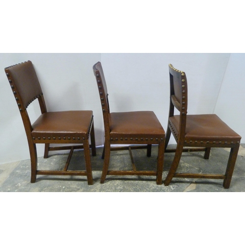 552 - Near-set of thirty oak English dining chairs, c. 1950s, with studded upholstery, stamped to the unde... 