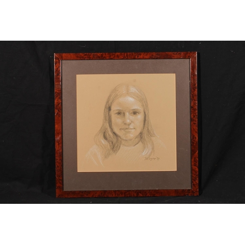 459 - D K LOGAN, bust length portrait of a girl, charcoal and chalk, signed and dated '97 lower right, 28c... 