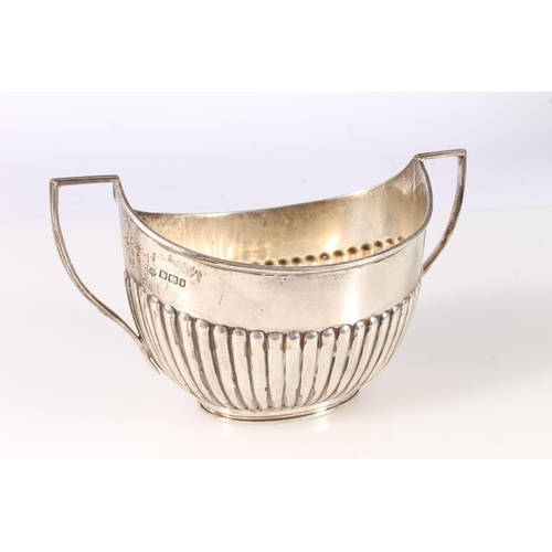 546 - Victorian silver sugar bowl of boat shape with half gadrooned decoration by William Hutton & Son... 