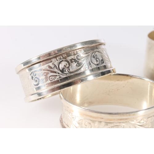 566 - Four silver napkin rings, various makers, 74g. (4)