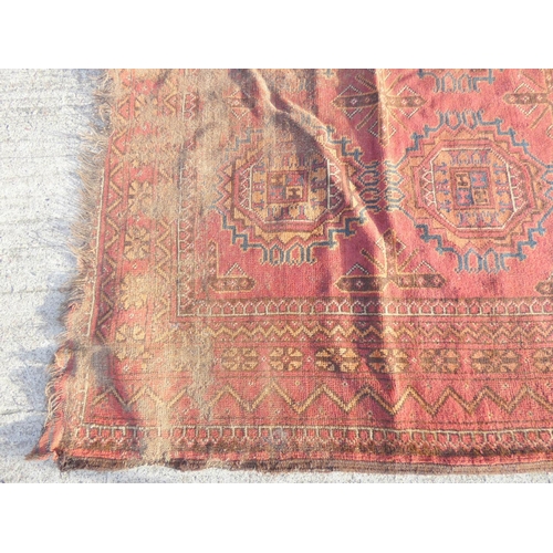 388 - Large 19th Century Persian Bokhara, red and blue rug L320cm x W227cm.