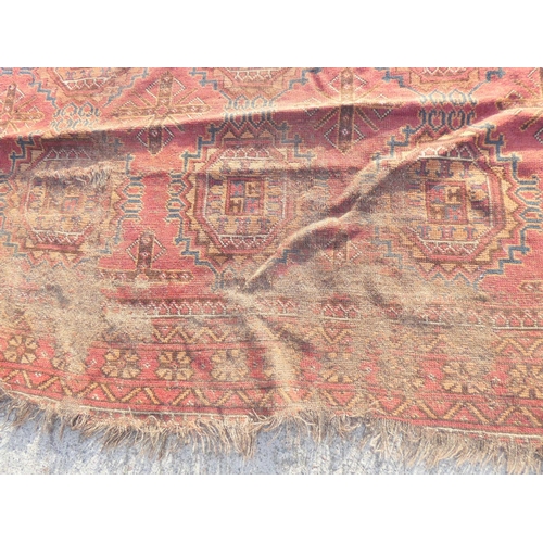 388 - Large 19th Century Persian Bokhara, red and blue rug L320cm x W227cm.