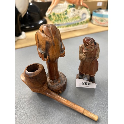 268 - Two carved Black Forest style figures, one in the form of a pipe.