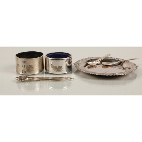 212 - Hallmarked silver to include dish marked Sheffield 1977, two salt spoons, two napkin rings, and a bo... 