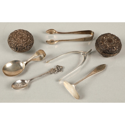 223 - Silver to include wishbone tongs, child's spoon and pusher, two bottle tops, and a plated Rolex spoo... 