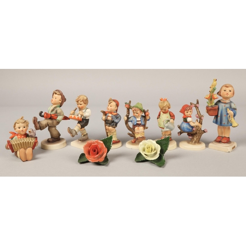 29 - Eight Hummel figurines & two Herend of Hungary rose figures