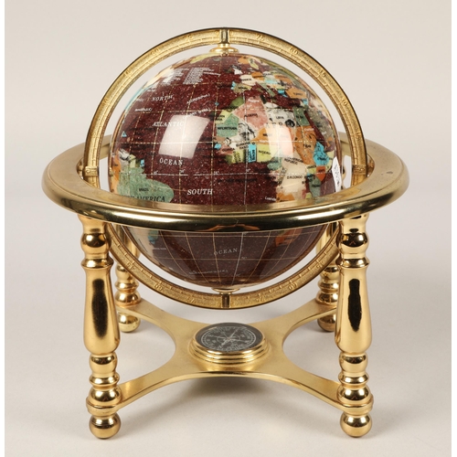 38 - Desk globe set with semi precious stones on brass stand, approx. 15cm diameter