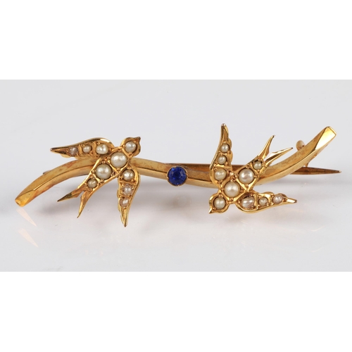 60 - 9ct gold bar brooch set with seed pearls and blue paste gem, 2g