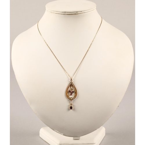 62 - Edwardian yellow metal pendant set with seed pearls and purple gems, on 9ct gold chain