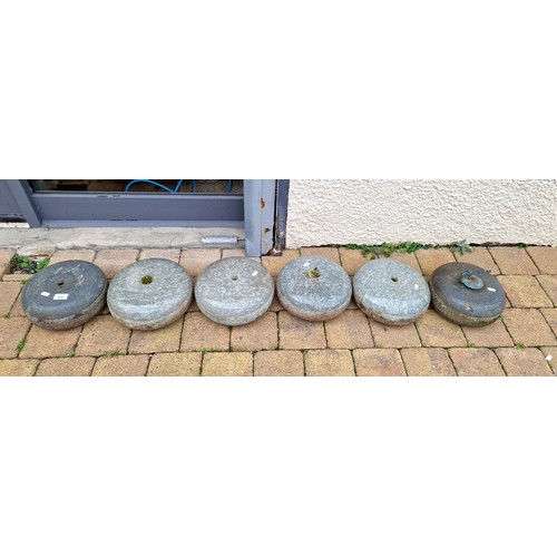 545 - Six curling stones, one with handle