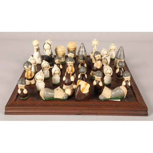 667 - Chess board with novelty pieces 