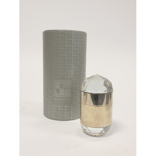 303 - Swarovski Crystal. Boxed faceted crystal cigarette lighter article no.7500, along with a similar cig... 