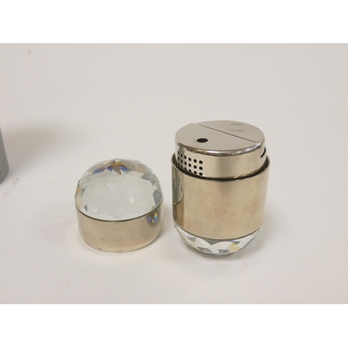 303 - Swarovski Crystal. Boxed faceted crystal cigarette lighter article no.7500, along with a similar cig... 