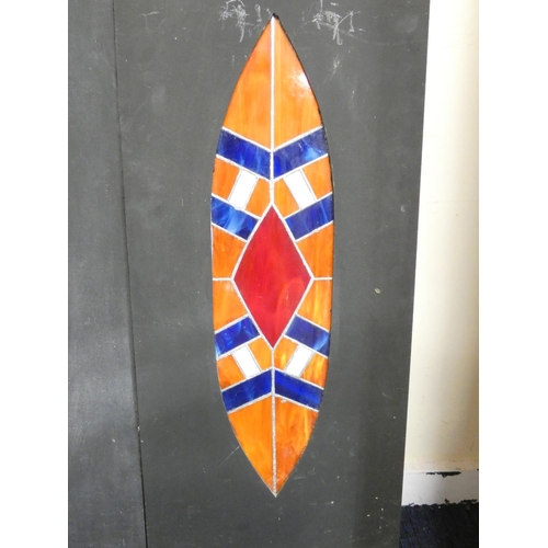 368 - Paul B Hardcastle. Abstract stained glass wall panels of stylised leaf or shield design. Both 45.5cm... 