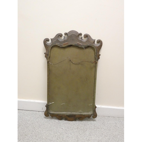 398 - Antique walnut fret framed mirror having scrolled pediment bearing painted panel of a floral bouquet... 