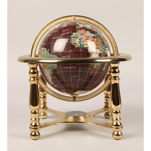 38 - Desk globe set with semi precious stones on brass stand, approx. 15cm diameter