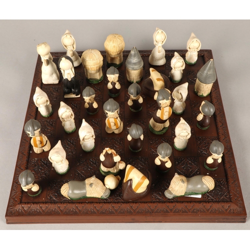 667 - Chess board with novelty pieces 