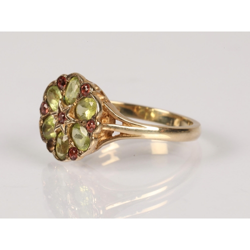 99 - 9ct gold ring set with green and orange-pink gemstones in a daisy cluster design, ring size O, 2.7g