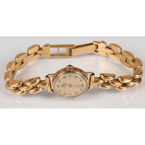 104 - 9ct gold ladies Omega wristwatch,  on a n 18ct gold strap stamped 750, gross weight 24.2g